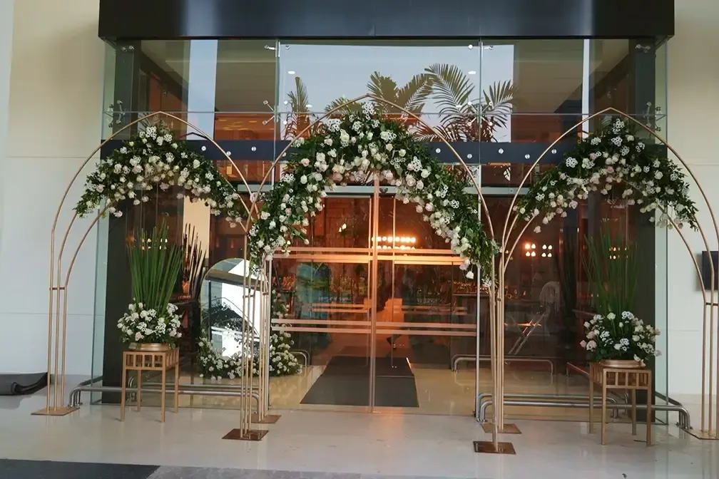 Floral entrance décor by Top Wedding Planners in Kerala